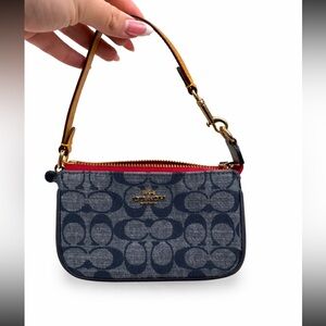Authentic Coach denim signature wristlet in a beautiful navy blue canvas 💙